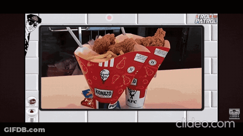 A Kfc Cone With Fried Chicken And French Fries On A Table GIF