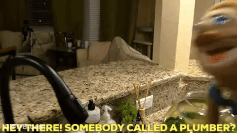 A Kitchen Counter With The Words Hey There Somebody Called A Plumber Above It GIF
