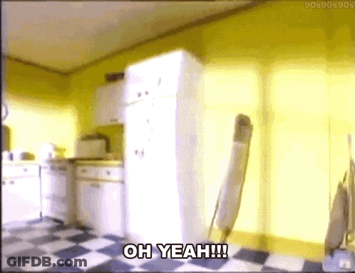 A Kitchen With A Checkered Floor And A White Refrigerator With The Words Oh Yeah !!! Written On It . GIF