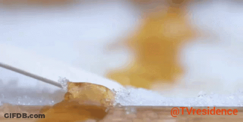 A Knife Is Cutting A Piece Of Jelly On A Cutting Board With The Words @Tvresidence In Red GIF