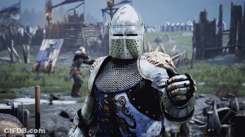 A Knight In Armor Is Holding A Sword And Shield GIF