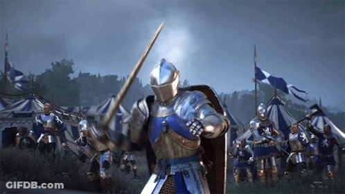 A Knight In Armor Is Holding A Sword In Front Of A Group Of Knights GIF