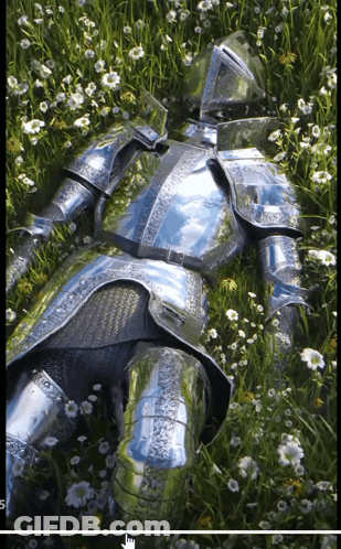 A Knight In Armor Is Laying In The Grass GIF