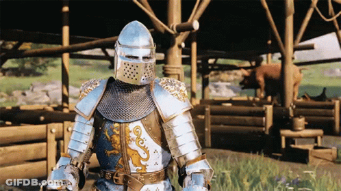 A Knight In Armor Is Standing In Front Of A Building GIF