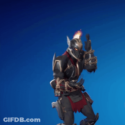 A Knight With A Flame On His Helmet Is Holding A Gun GIF