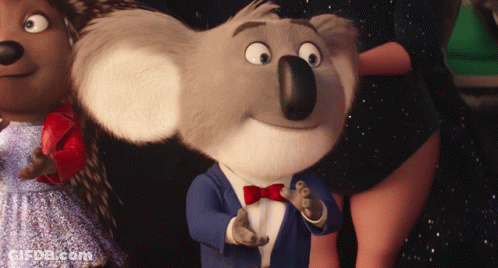 A Koala Wearing A Suit And Bow Tie Is Standing Next To A Hedgehog GIF