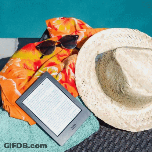 A Kobo Device Is Laying On A Beach Towel Next To A Hat And Sunglasses GIF