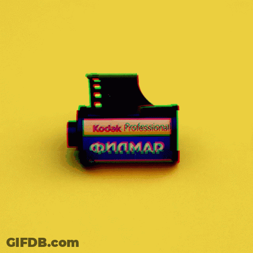 A Kodak Professional Film On A Yellow Surface GIF