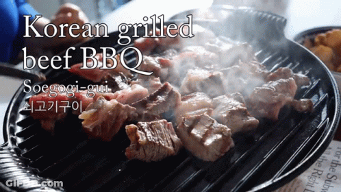 A Korean Grilled Beef Bbq Being Cooked On A Grill GIF