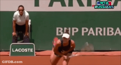 A Lacoste Sign Is In Front Of A Bnp Pariba Sign GIF