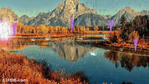 A Lake With Mountains In The Background And Rain Coming Down GIF
