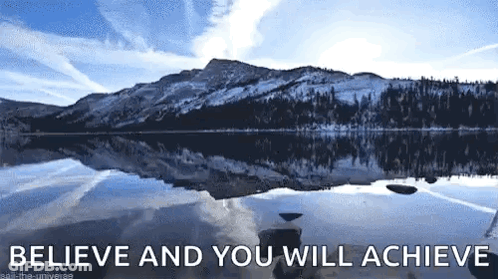 A Lake With Mountains In The Background And The Words `` Believe And You Will Achieve '' Above It GIF