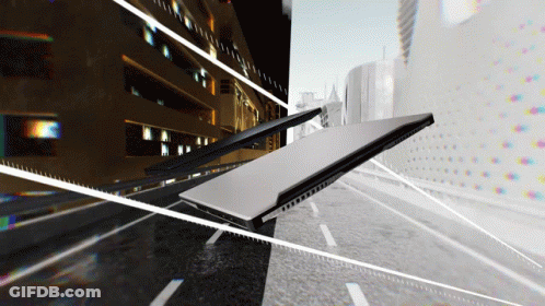 A Laptop Is Laying On Its Side On A Street GIF