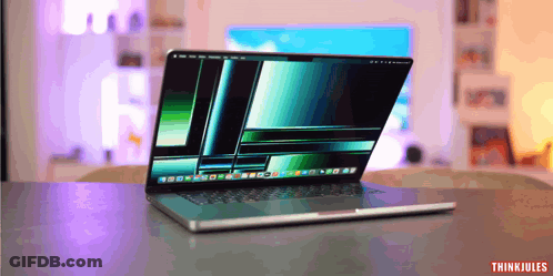 A Laptop Is Open On A Table And The Words Thinkjules Are On The Bottom Right GIF