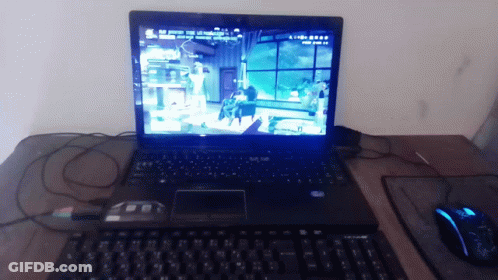 A Laptop Is Open To A Video Game Called Aliens GIF