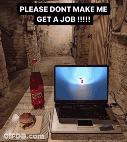 A Laptop Sits On A Table Next To A Bottle Of Sunkist Soda GIF
