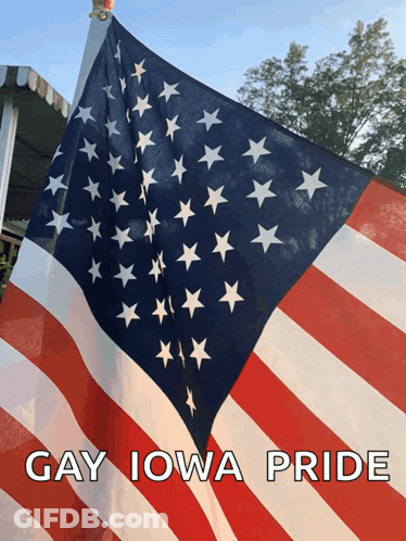 A Large American Flag With The Words Gay Iowa Pride Above It GIF