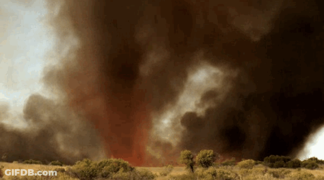 A Large Amount Of Smoke Is Coming Out Of The Sky GIF