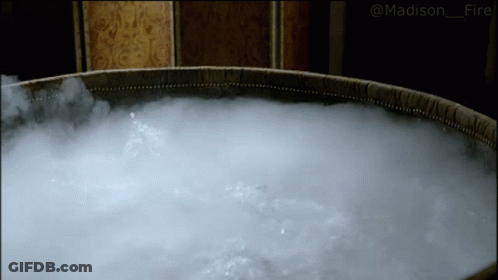 A Large Barrel Filled With Water And Smoke With The Hashtag Madison_fire On The Bottom GIF