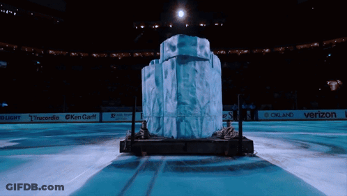 A Large Block Of Ice Sits In The Middle Of An Ice Rink Sponsored By Verizon And Oakland GIF