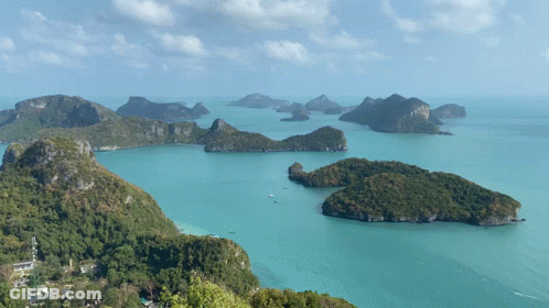 A Large Body Of Water Surrounded By Islands And Mountains GIF