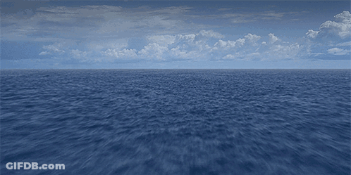 Large Water Body With Blue Sky And Clouds GIF