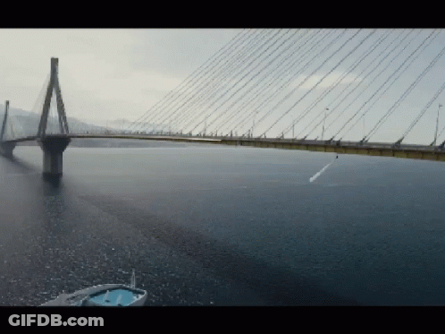 A Large Bridge Over A Body Of Water GIF