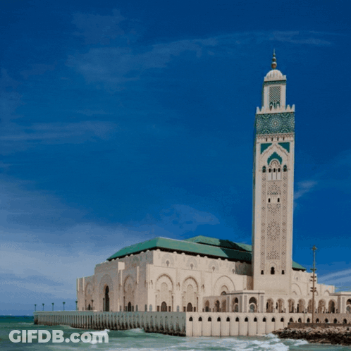 A Large Building With A Blue Sky And The Letter Ap Above It GIF