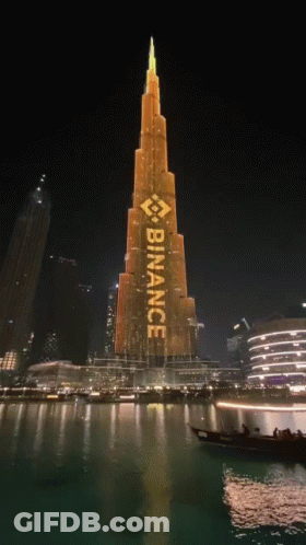 A Large Building With The Word Binance Written On It GIF