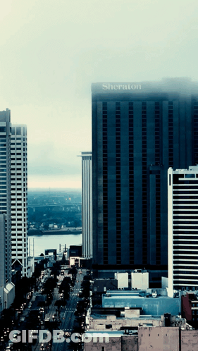 A Large Building With The Word Sheraton On The Top GIF
