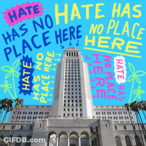 A Large Building With The Words Hate Has No Place Here GIF