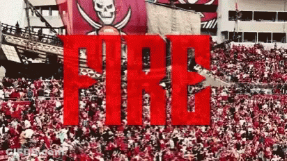 A Large Crowd Of People Are Gathered In A Stadium With The Word Fire In The Foreground . GIF