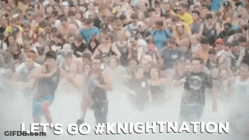A Large Crowd Of People Are Running Through A Foggy Field With The Words Let 'S Go #Knightnation Written On The Bottom GIF