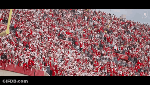 A Large Crowd Of People In A Stadium With The Number 25 On The Bleachers GIF