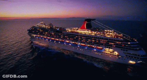 A Large Cruise Ship Is Floating In The Ocean GIF