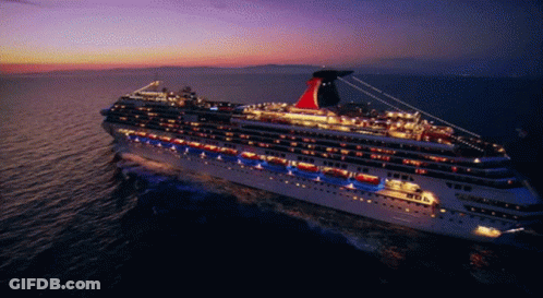 A Large Cruise Ship With The Word Carnival On The Side GIF