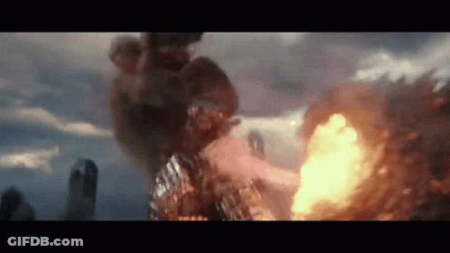 A Large Explosion Is Taking Place In A City With A Lot Of Fire Coming Out Of It . GIF