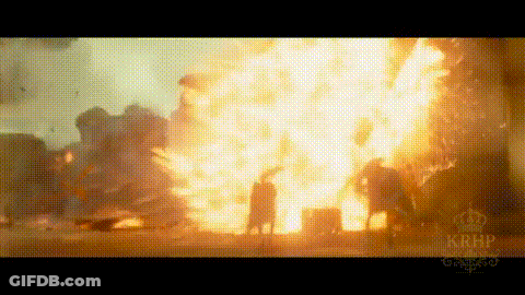 A Large Explosion Is Taking Place In The Middle Of A City . GIF