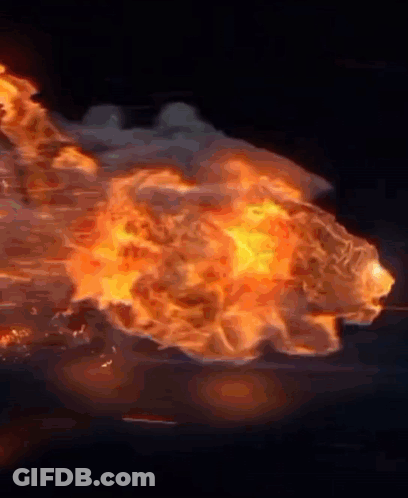 A Large Explosion With A Lot Of Fire Coming Out Of It . GIF