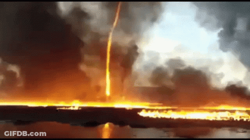 A Large Fire Is Coming Out Of The Ground And A Lightning Bolt Is Coming From The Sky . GIF