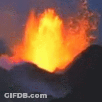 A Large Fireball Is Erupting From A Volcano In The Night Sky GIF