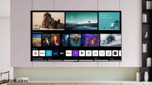 A Large Flat Screen Tv Is Displaying A Home Dashboard With Apps Like Netflix And Youtube GIF
