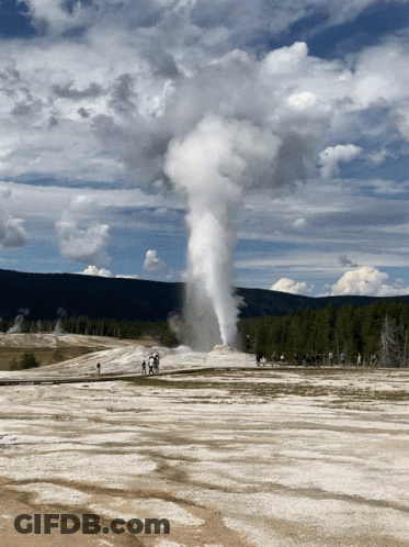 A Large Geyser Is Erupting In The Middle Of A Desert GIF