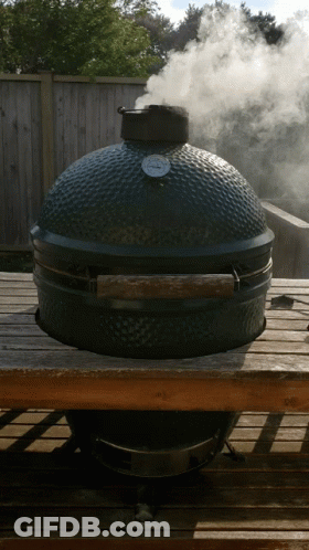 A Large Grill With A Thermometer On Top Of It GIF