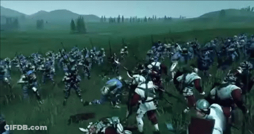 A Large Group Of Medieval Soldiers Are Fighting In A Field . GIF