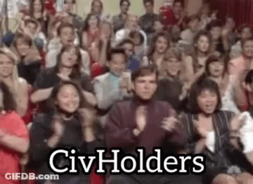 A Large Group Of People Are Clapping And Applauding In A Room . GIF