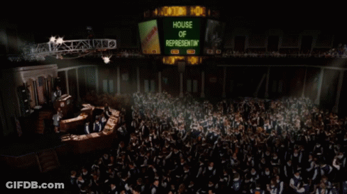 A Large Group Of People Are Gathered In Front Of A Sign That Says House Of Representatives GIF