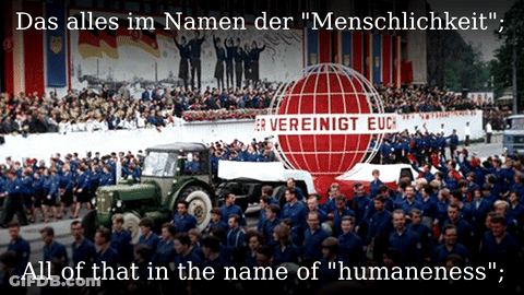 A Large Group Of People Are Gathered In Front Of A Sign That Says Vereinigt Euc GIF