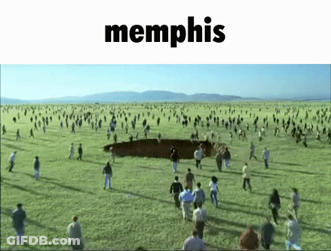 A Large Group Of People Are Running In A Field With The Word Memphis In The Corner GIF