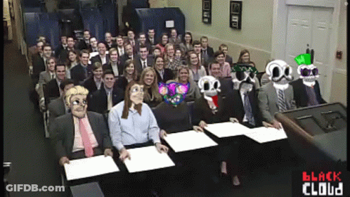 A Large Group Of People Are Sitting In A Room With The Words Black Cloud Written On The Bottom GIF